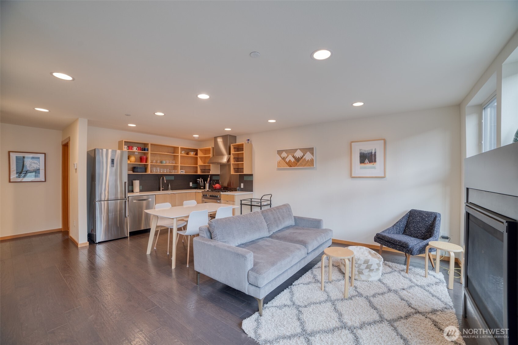 200 Pass Life Way, Unit 1 Snoqualmie Pass, WA 98068 - Photo 5 of 27 a living room with couches and kitchen view with wooden floor