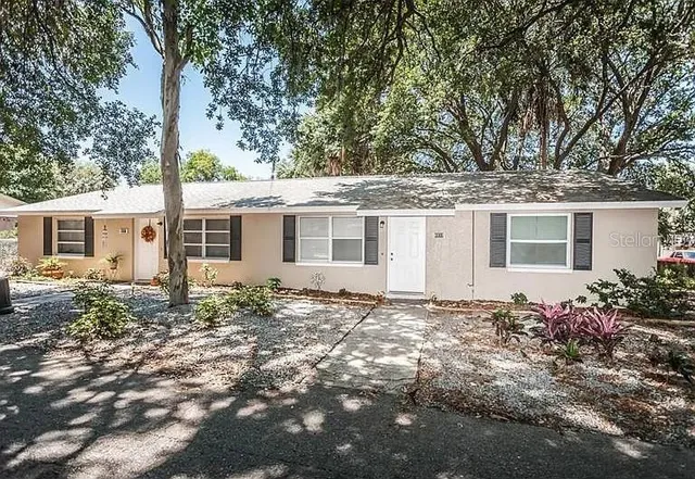 front view of a house with a yard