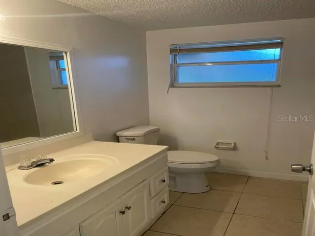 a bathroom with a sink a toilet and a bathtub