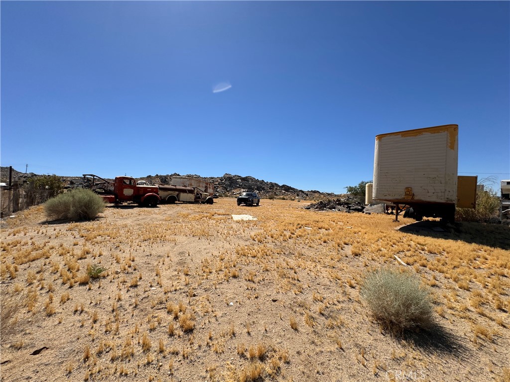 469 211250000th Oro Grande, CA 92368 - Photo 8 of 15 a view of a dry yard with a snow on the road