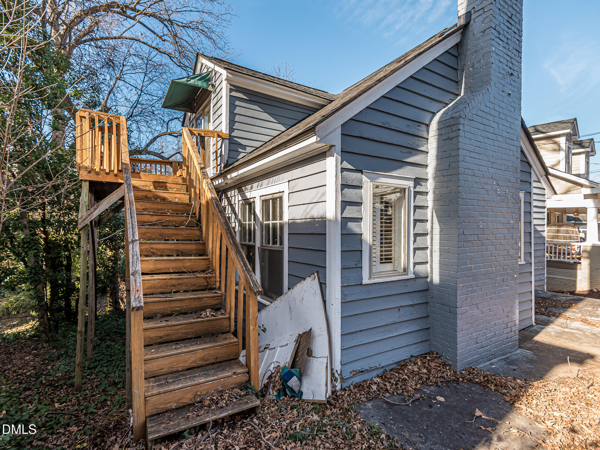 1825 White Oak Road Raleigh, NC 27608 - Photo 6 of 35 a view of a house with a small yard and wooden floor and fence