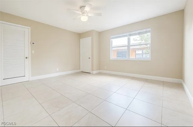 a view of an empty room with a window
