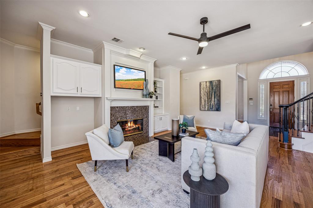 3703 Trailwood Drive Richardson, TX 75082 - Photo 12 of 40 a living room with furniture and a fireplace