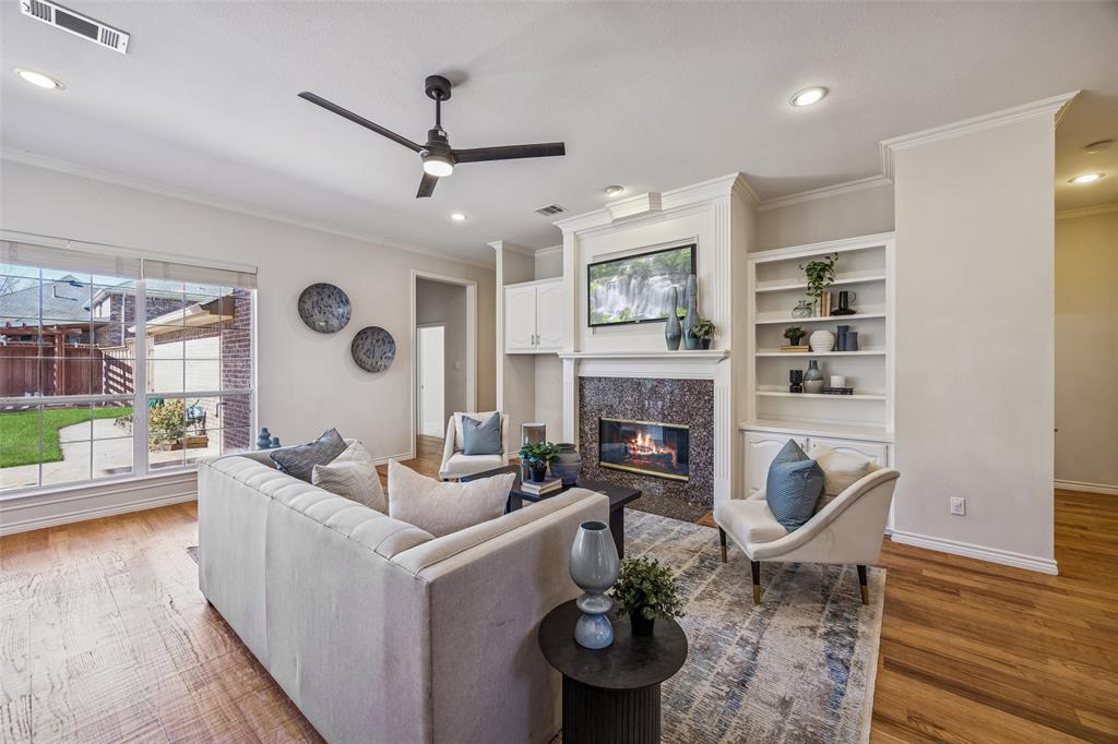 3703 Trailwood Drive Richardson, TX 75082 - Photo 4 of 40 a living room with furniture and a fireplace
