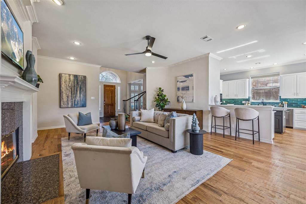 3703 Trailwood Drive Richardson, TX 75082 - Photo 7 of 40 a living room with furniture and a wooden floor