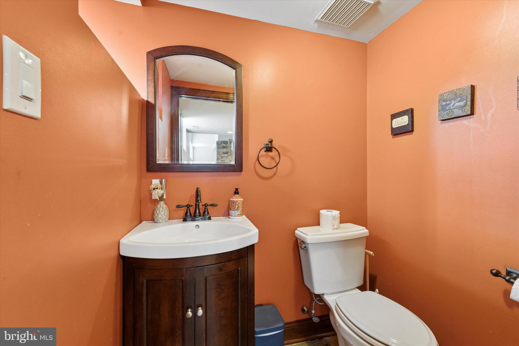 204 East Manoa Road Havertown, PA 19083 - Photo 25 of 80 a bathroom with a toilet a sink and mirror