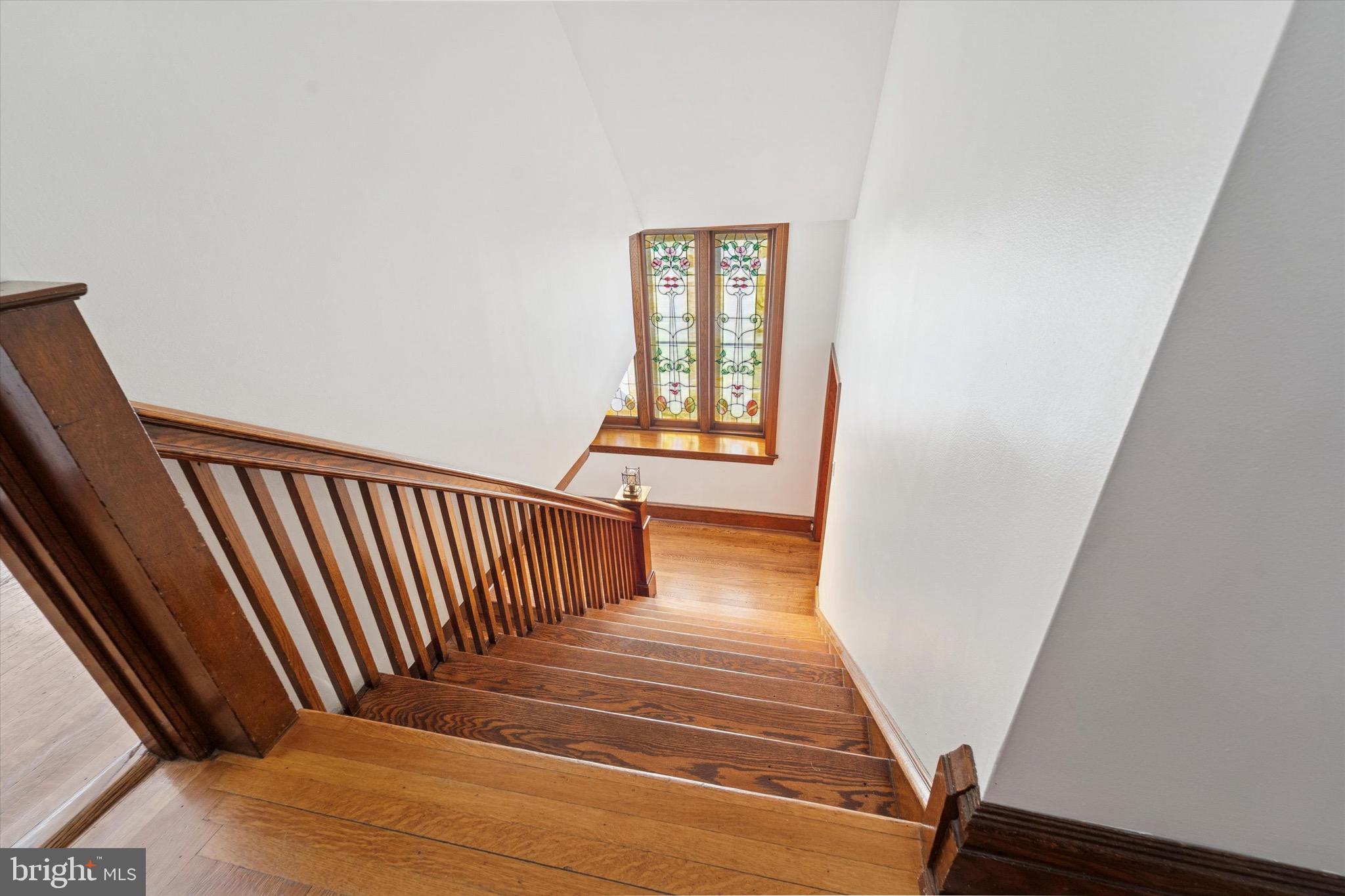 204 East Manoa Road Havertown, PA 19083 - Photo 31 of 80 a view of a hallway with wooden floor and staircase