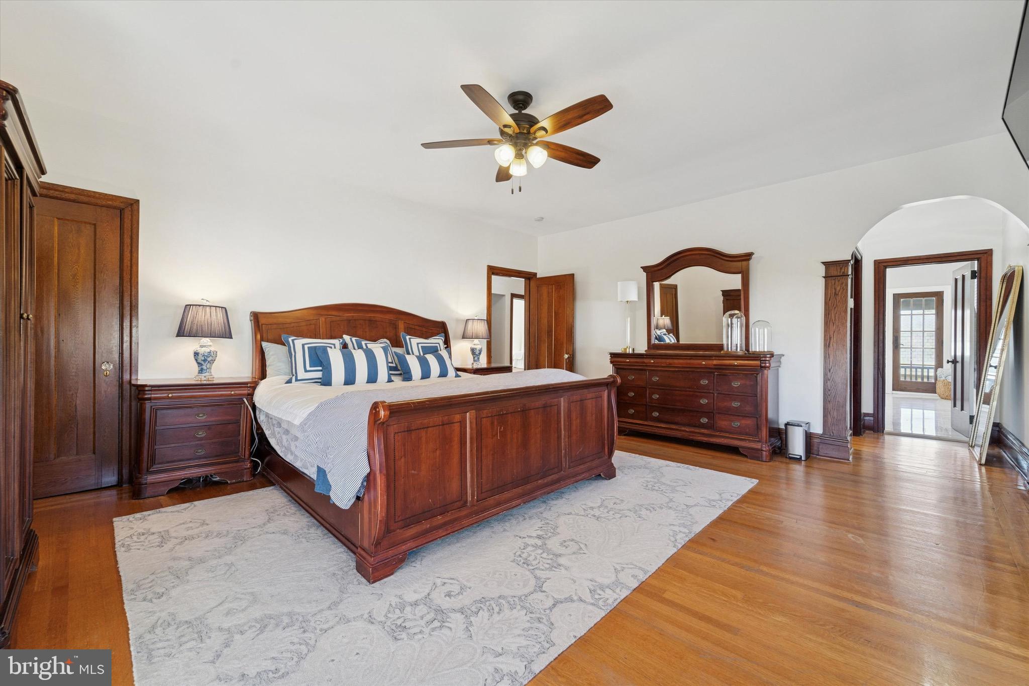 204 East Manoa Road Havertown, PA 19083 - Photo 41 of 80 a living room with a bed furniture and a large mirror