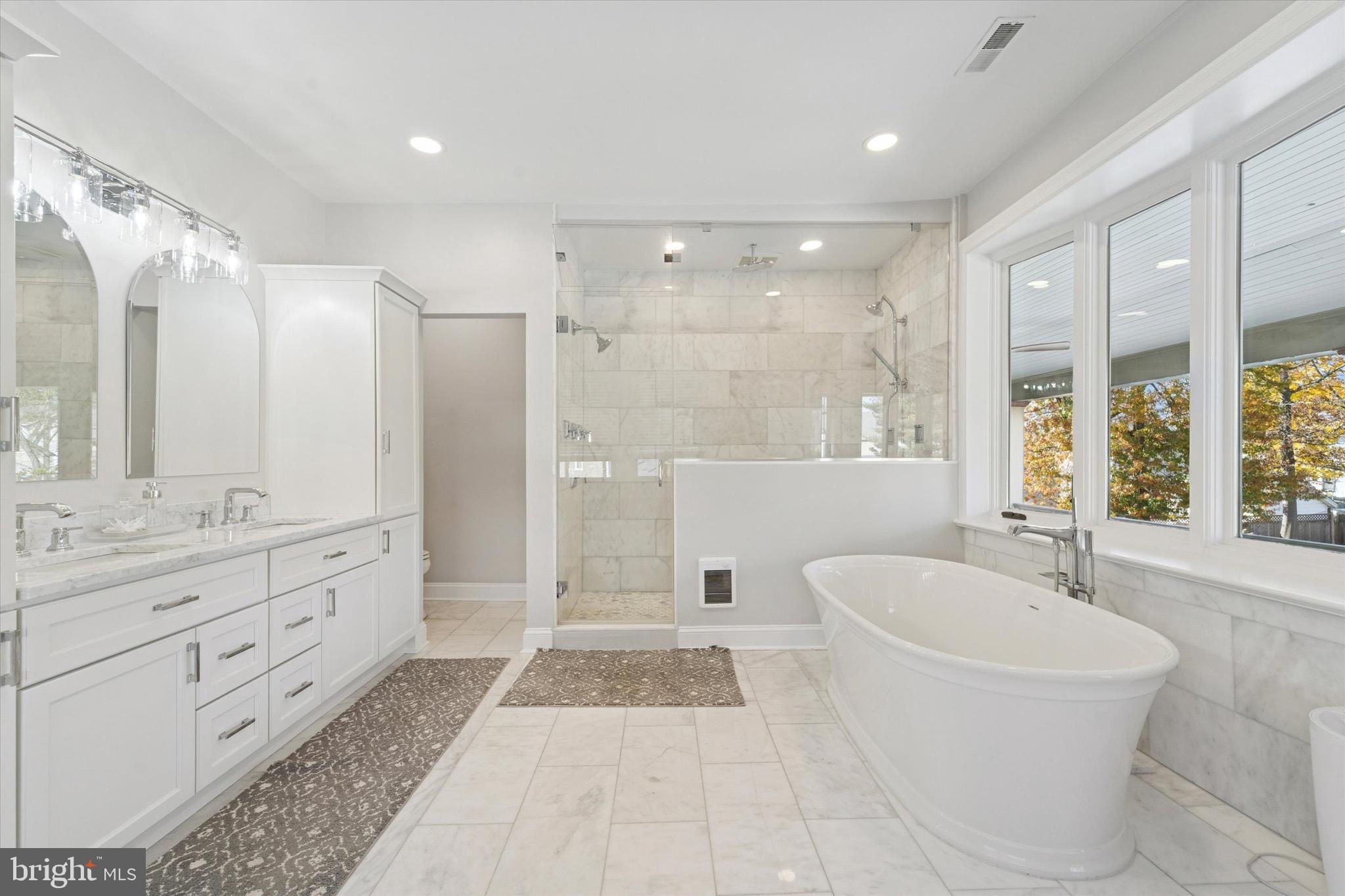 204 East Manoa Road Havertown, PA 19083 - Photo 44 of 80 a bathroom with a tub sink shower and mirror