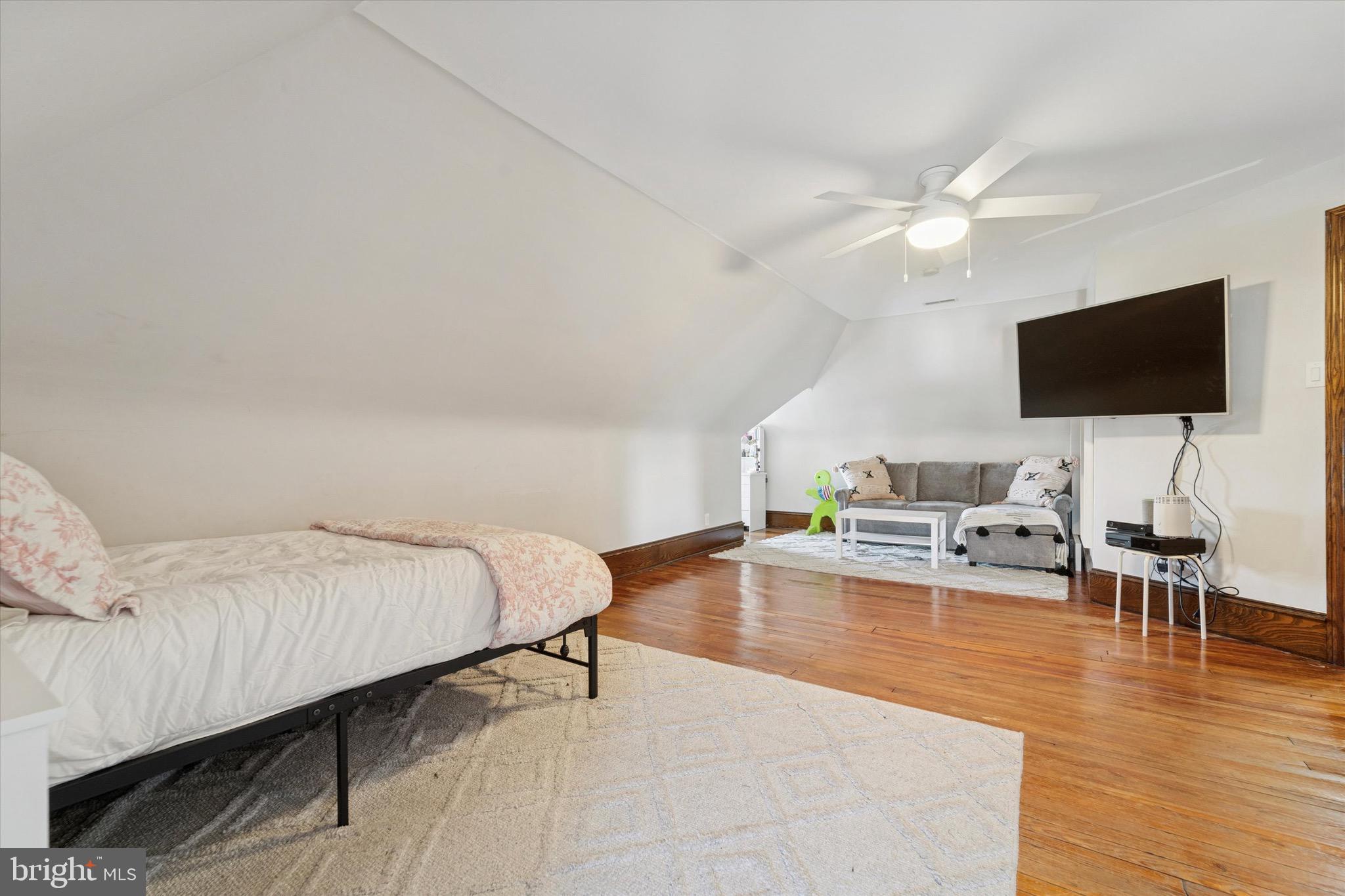 204 East Manoa Road Havertown, PA 19083 - Photo 54 of 80 a spacious bedroom with a bed and a flat screen tv