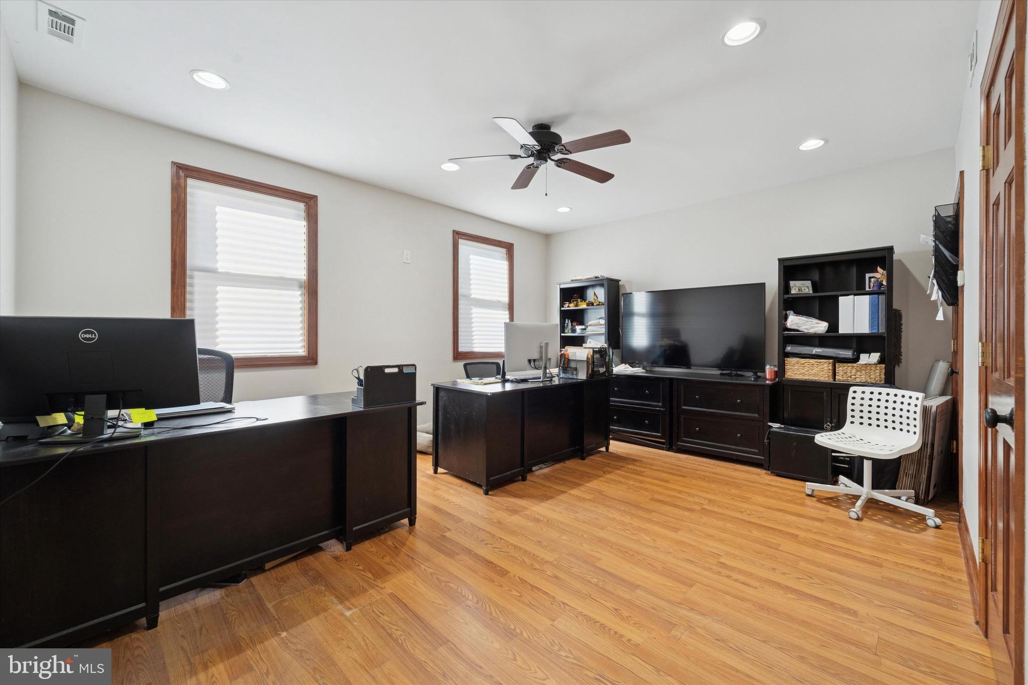 204 East Manoa Road Havertown, PA 19083 - Photo 59 of 80 a living room with furniture a desk and a flat screen tv