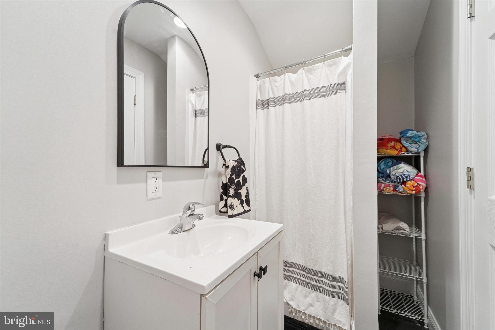 204 East Manoa Road Havertown, PA 19083 - Photo 71 of 80 a bathroom with a sink vanity and a mirror