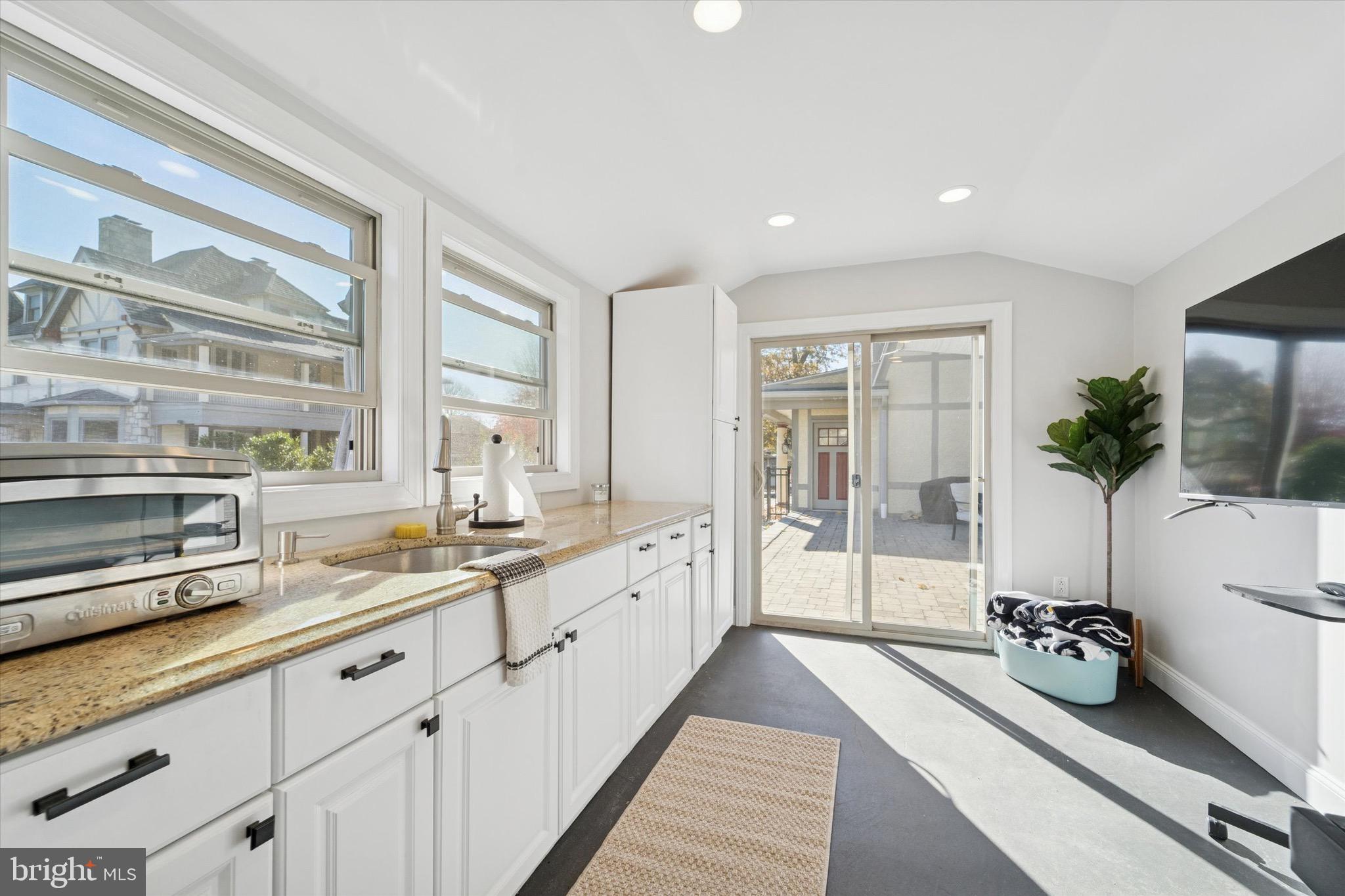 204 East Manoa Road Havertown, PA 19083 - Photo 72 of 80 a large kitchen with a large window and stainless steel appliances