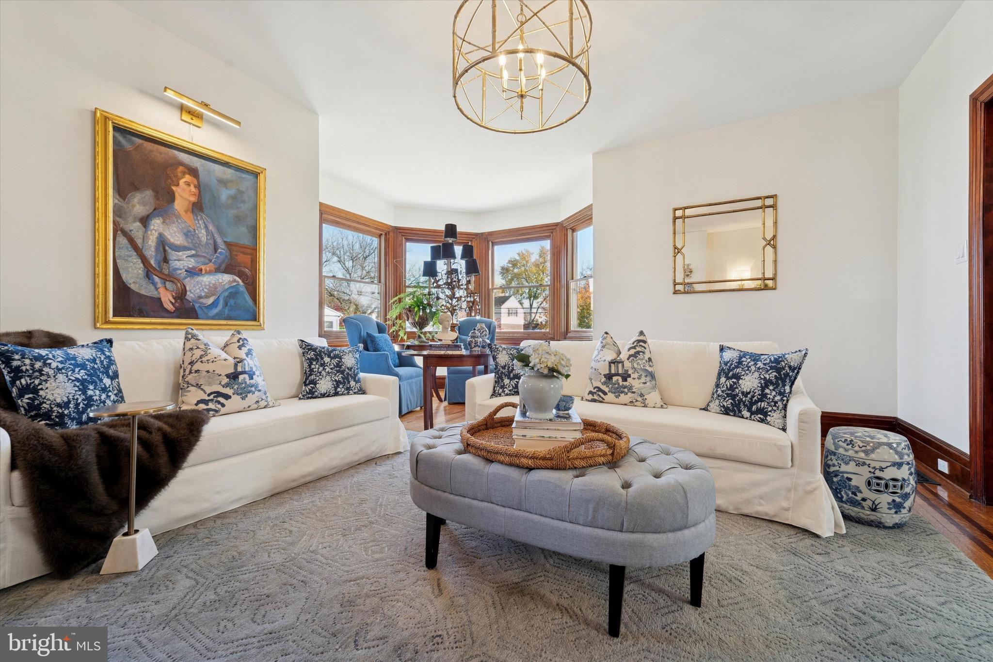204 East Manoa Road Havertown, PA 19083 - Photo 9 of 80 a living room with furniture a rug and a wall painting