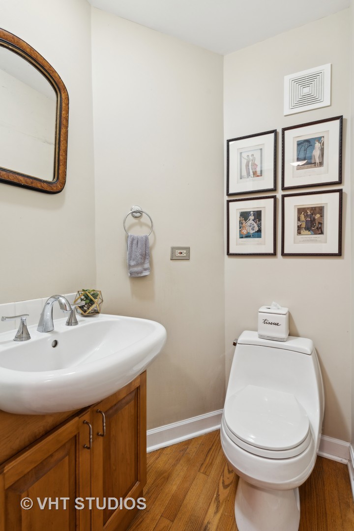 803 Hibbard Road Wilmette, IL 60091 - Photo 11 of 23 a bathroom with a sink and a toilet