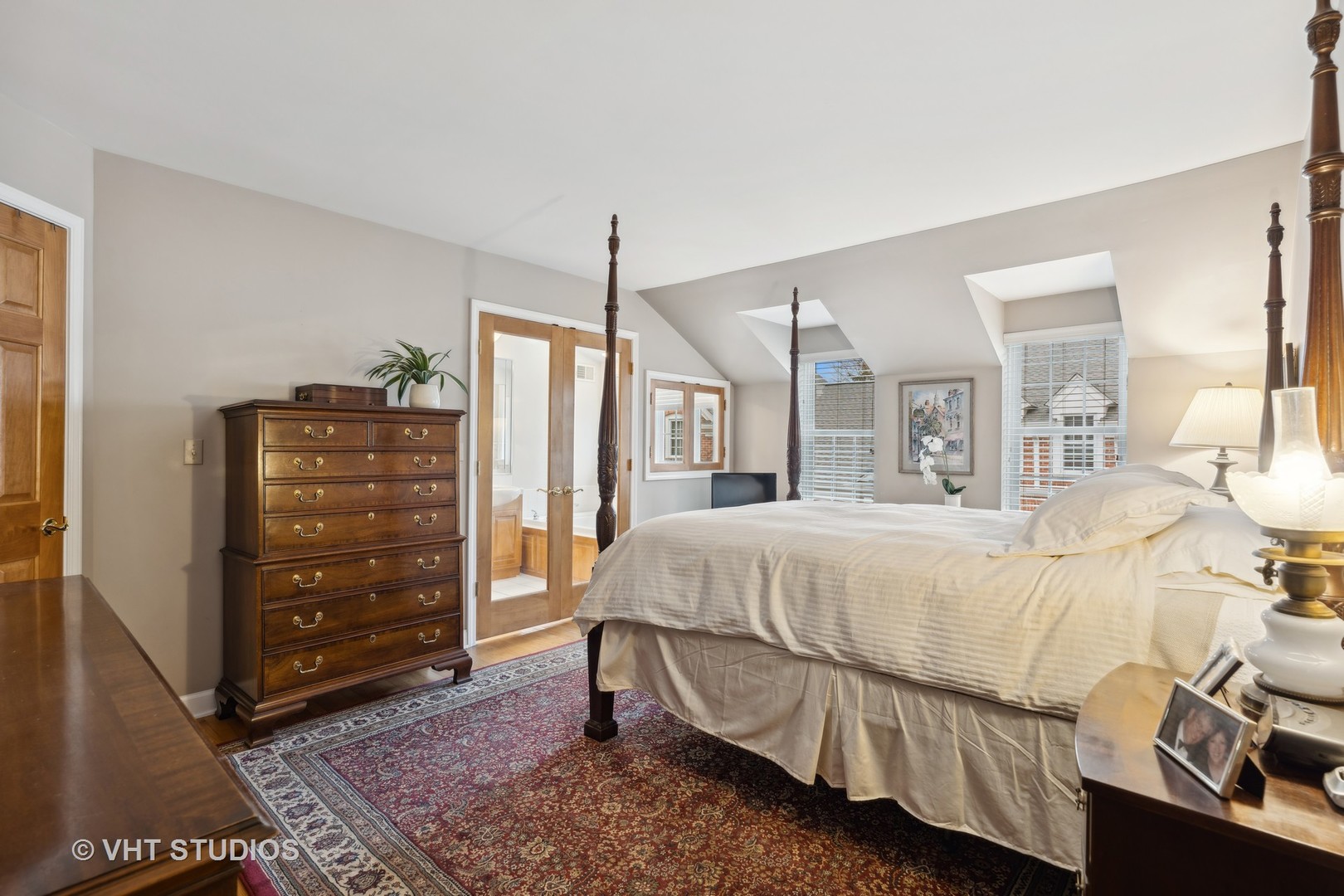 803 Hibbard Road Wilmette, IL 60091 - Photo 12 of 23 a bedroom with a bed a dresser and a mirror