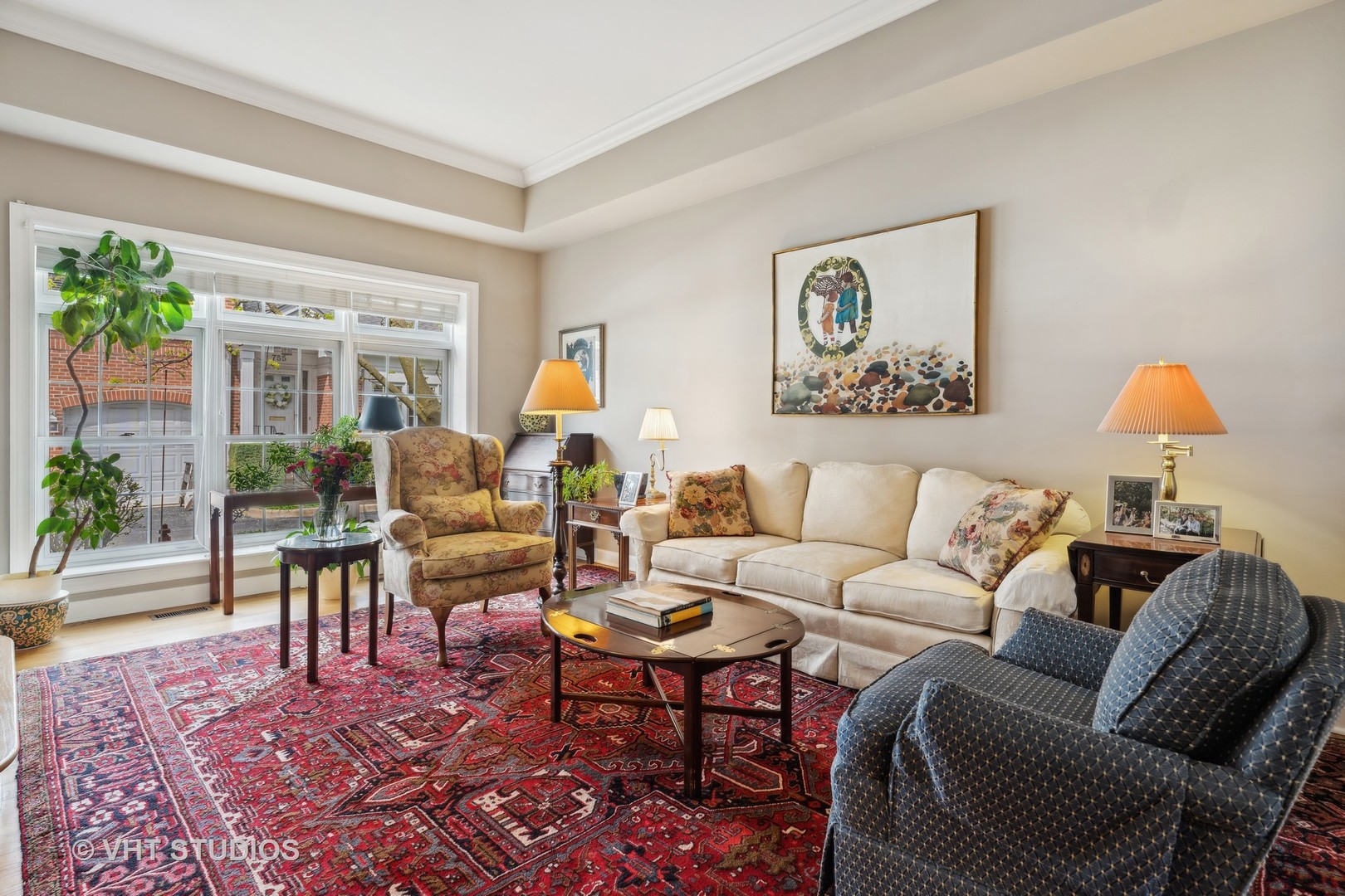 803 Hibbard Road Wilmette, IL 60091 - Photo 3 of 23 a living room with furniture a lamp a rug and a window