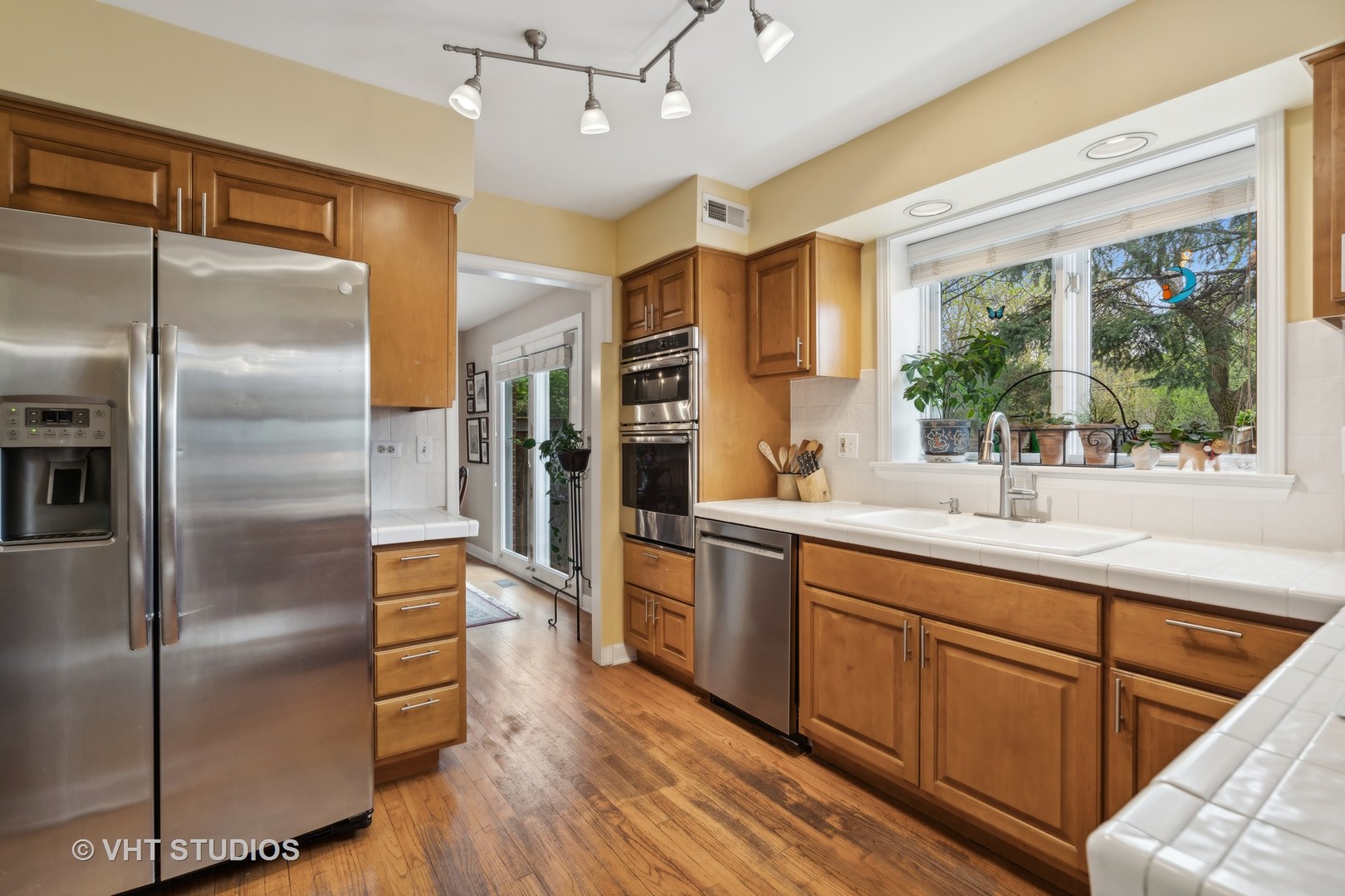 803 Hibbard Road Wilmette, IL 60091 - Photo 7 of 23 a kitchen with stainless steel appliances granite countertop a refrigerator and a sink