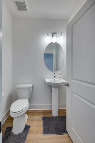 a bathroom with a toilet and a sink