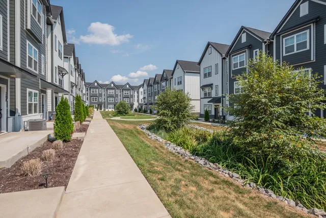 a view of a building with a yard
