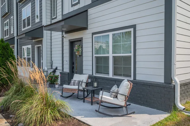 a view of backyard with outdoor seating