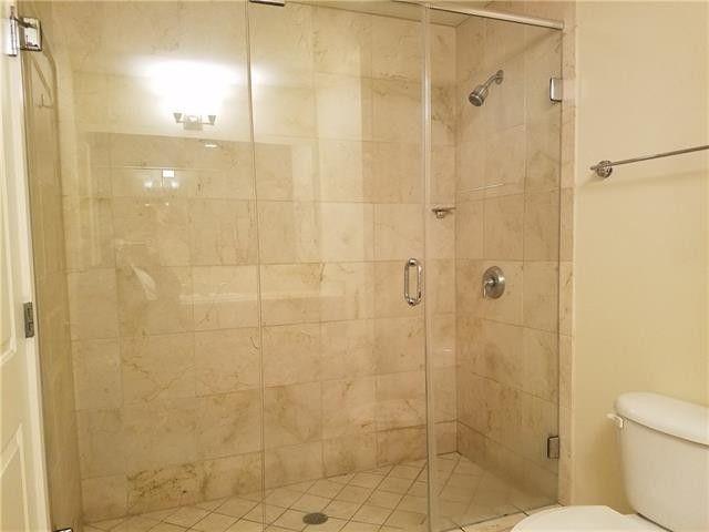 1200 Main Street, Unit 1010 Dallas, TX 75202 - Photo 12 of 13 a bathroom with a shower and toilet