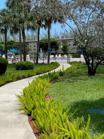 a view of a swimming pool with a garden