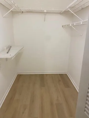 a view of a room with shelf on the wall