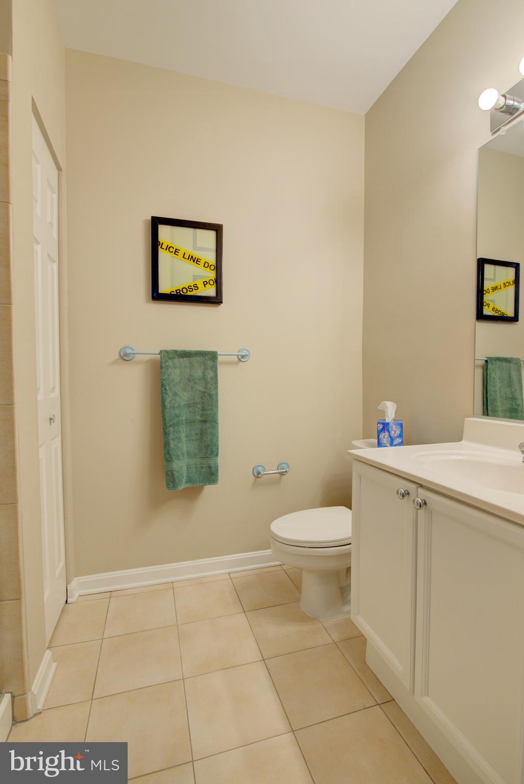 1855 Stratford Park Place, Unit 310 Reston, VA 20190 - Photo 22 of 62 a white toilet sitting next to a bathroom sink