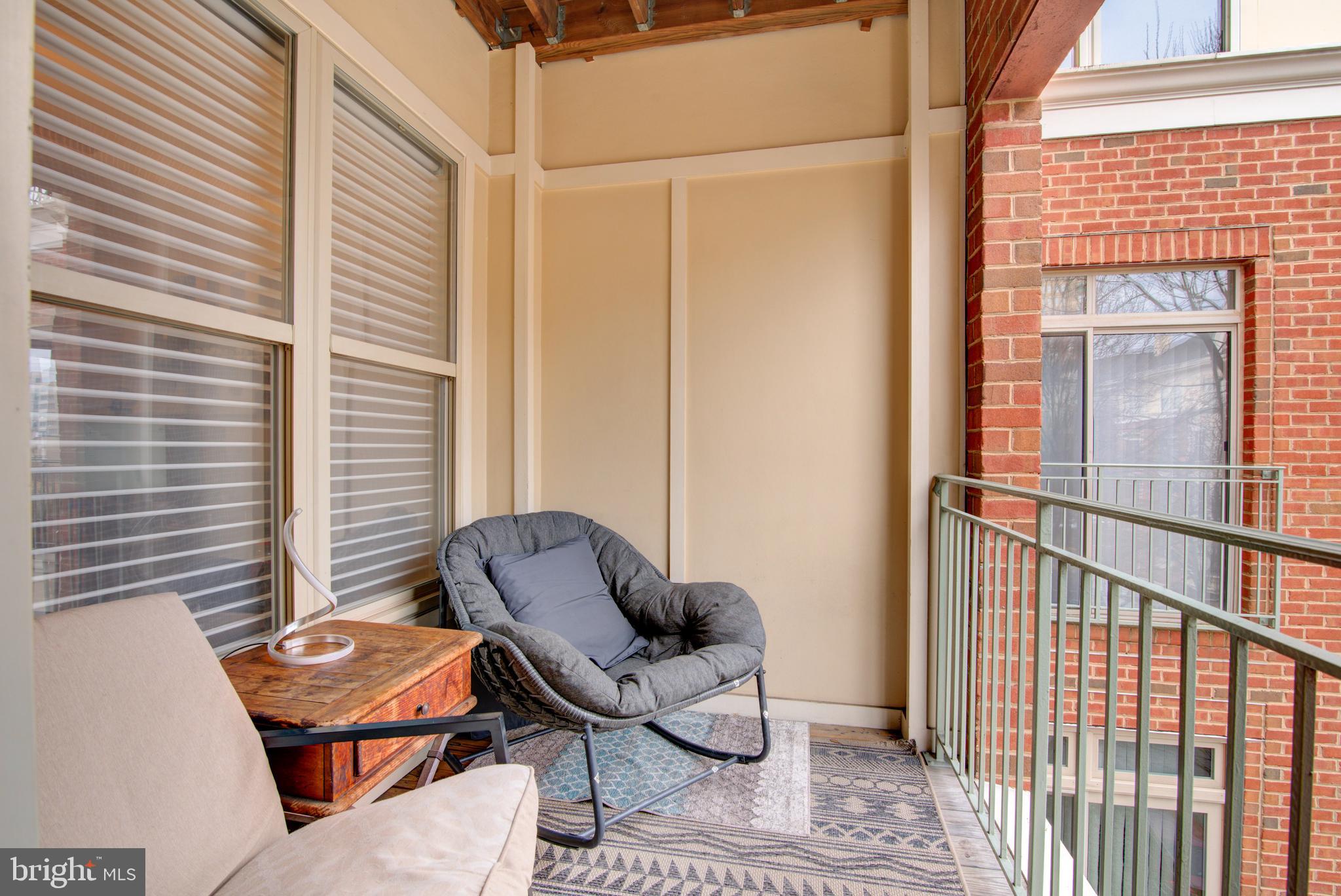 1855 Stratford Park Place, Unit 310 Reston, VA 20190 - Photo 24 of 62 a backyard of a house with outdoor seating