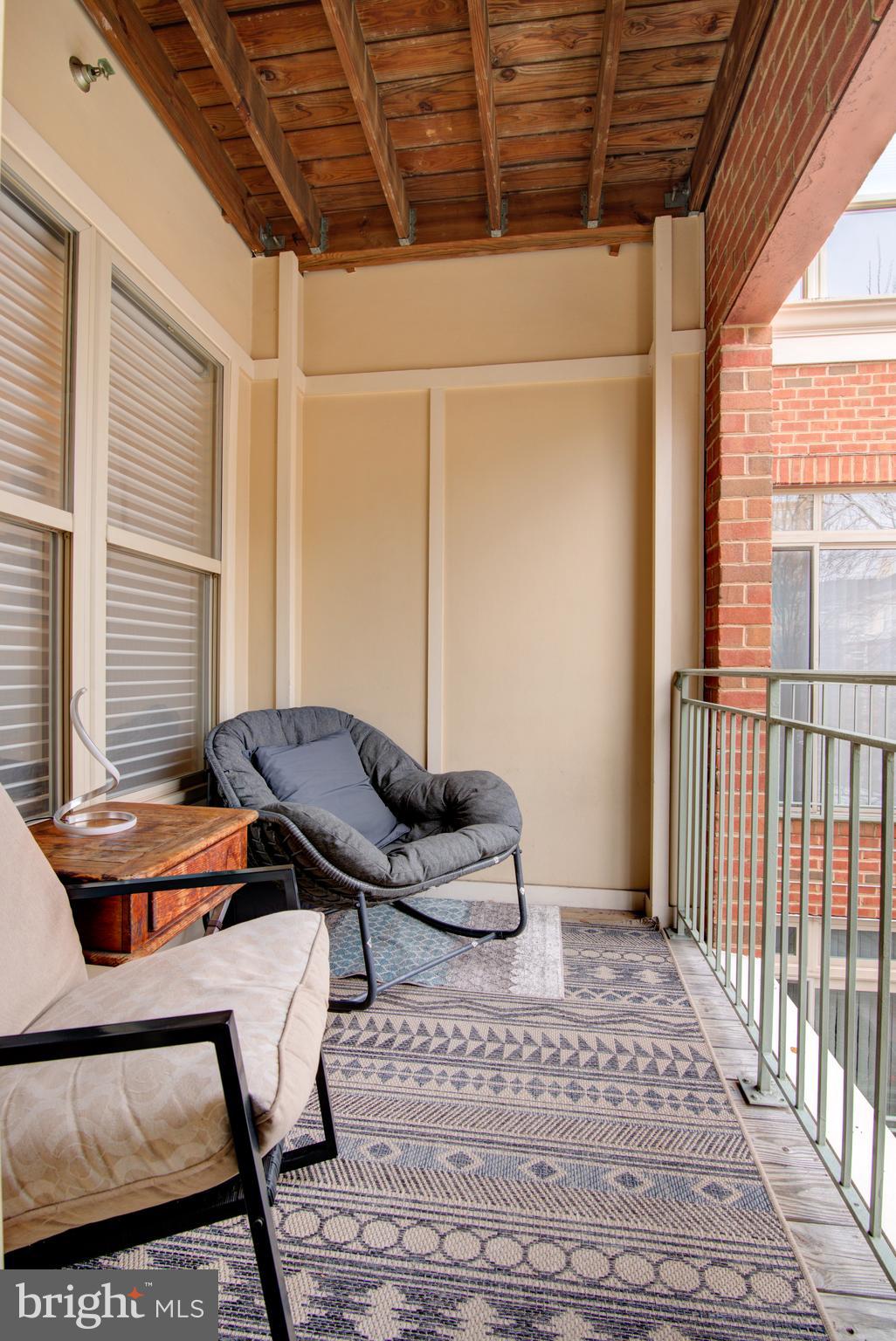 1855 Stratford Park Place, Unit 310 Reston, VA 20190 - Photo 25 of 62 a view of a workspace with furniture and a window