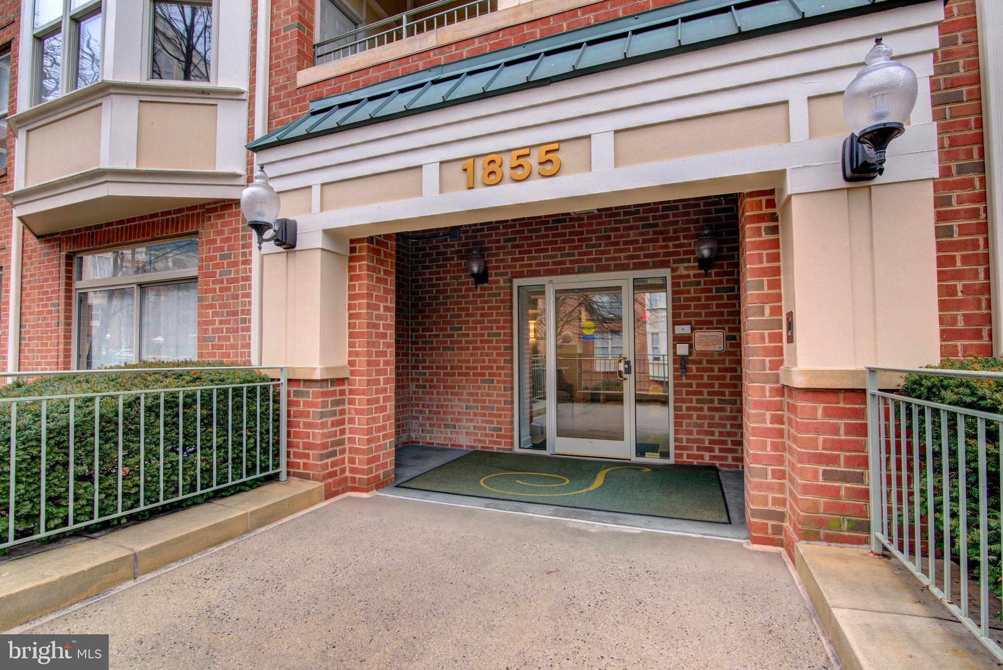1855 Stratford Park Place, Unit 310 Reston, VA 20190 - Photo 26 of 62 front view of a building