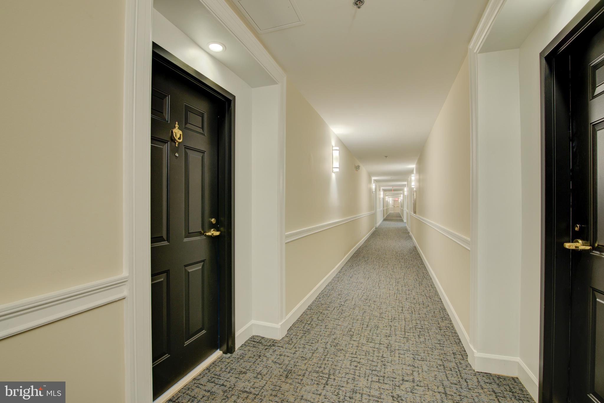 1855 Stratford Park Place, Unit 310 Reston, VA 20190 - Photo 30 of 62 a view of hallway with wooden floor