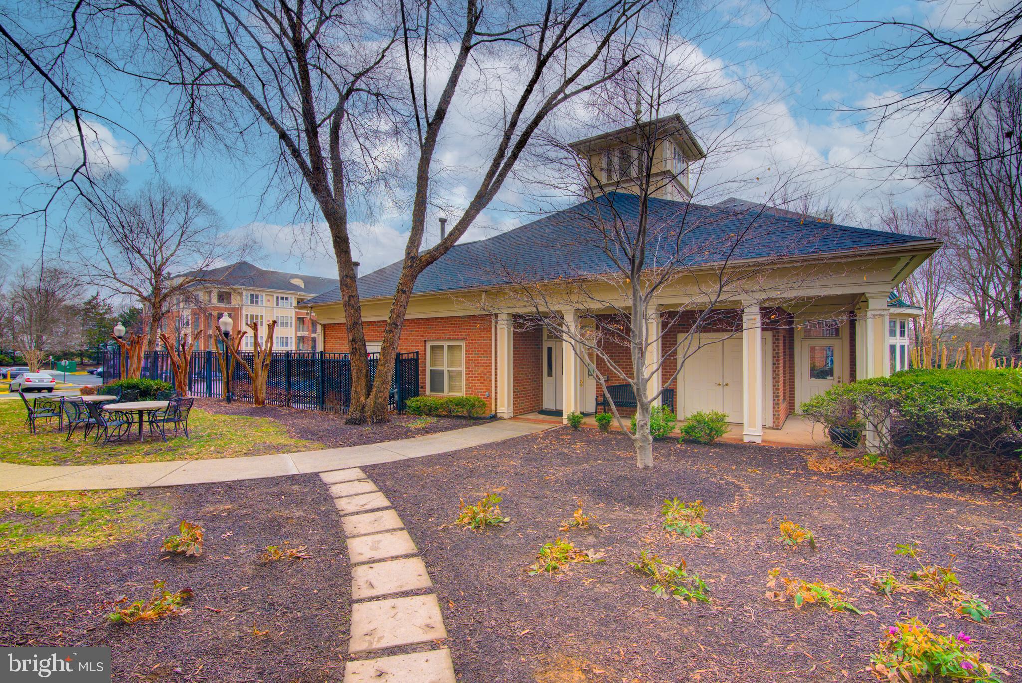 1855 Stratford Park Place, Unit 310 Reston, VA 20190 - Photo 35 of 62 a view of a building with a patio
