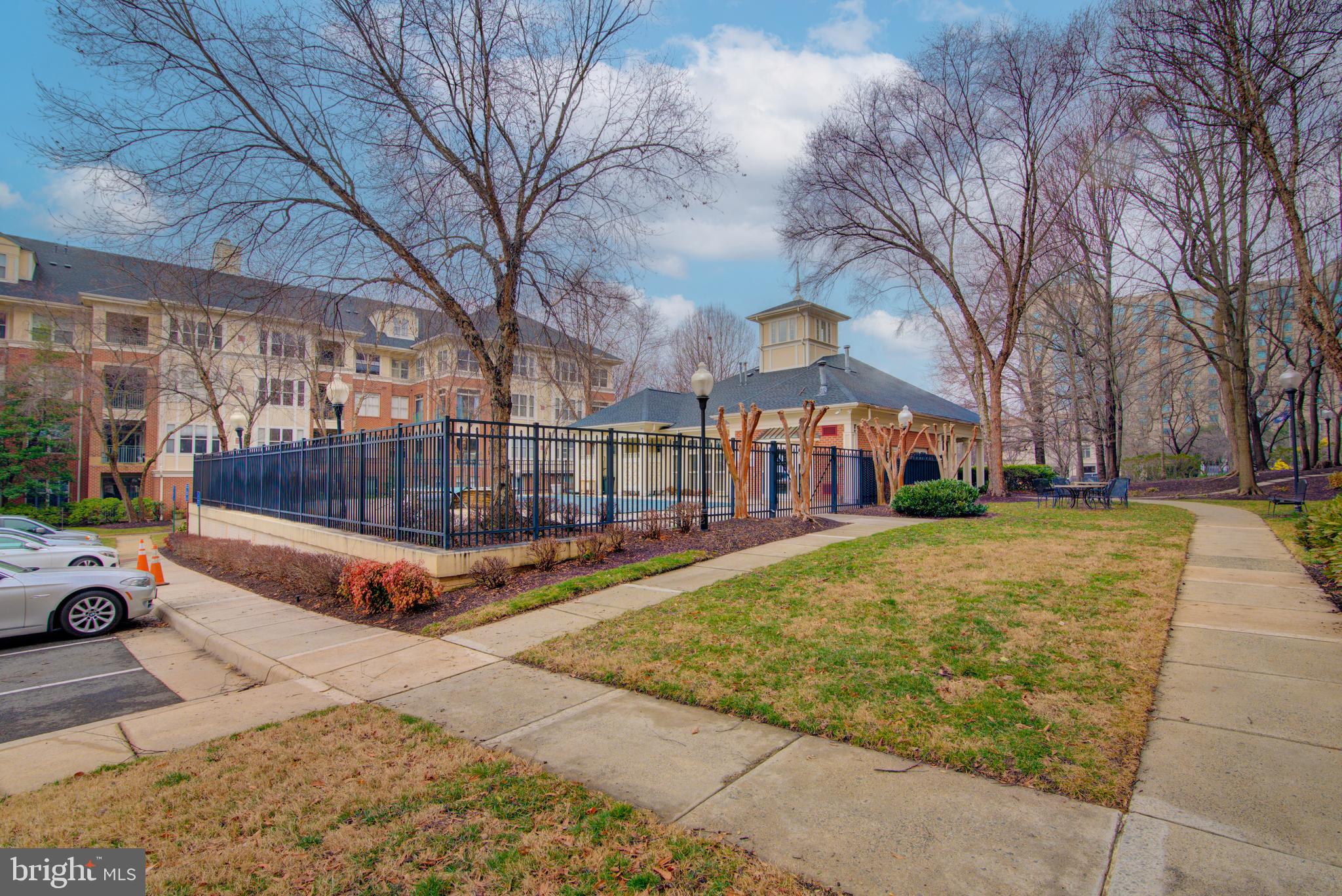 1855 Stratford Park Place, Unit 310 Reston, VA 20190 - Photo 43 of 62 a view of a building with cars parked