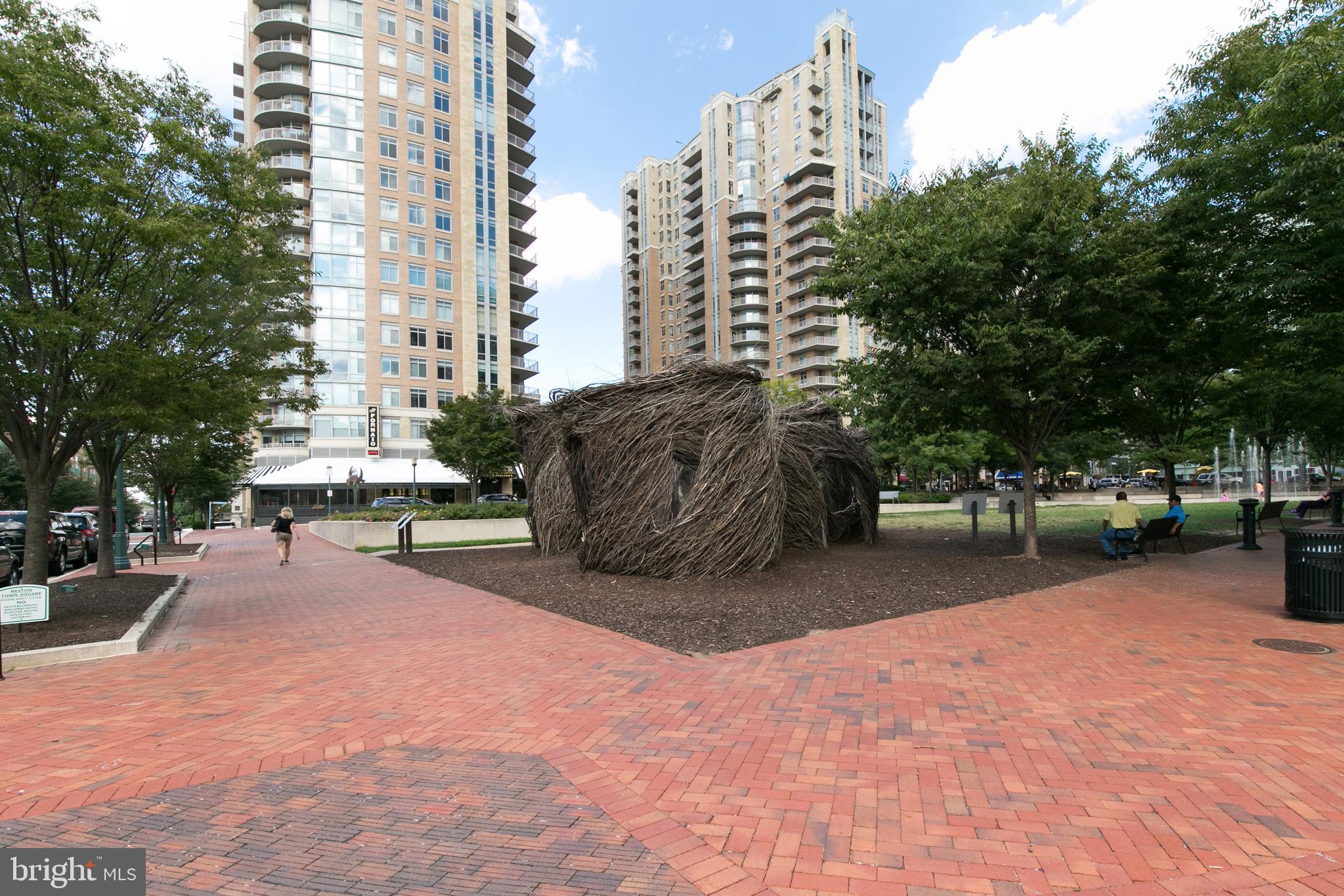 1855 Stratford Park Place, Unit 310 Reston, VA 20190 - Photo 51 of 62 a view of a city with tall buildings