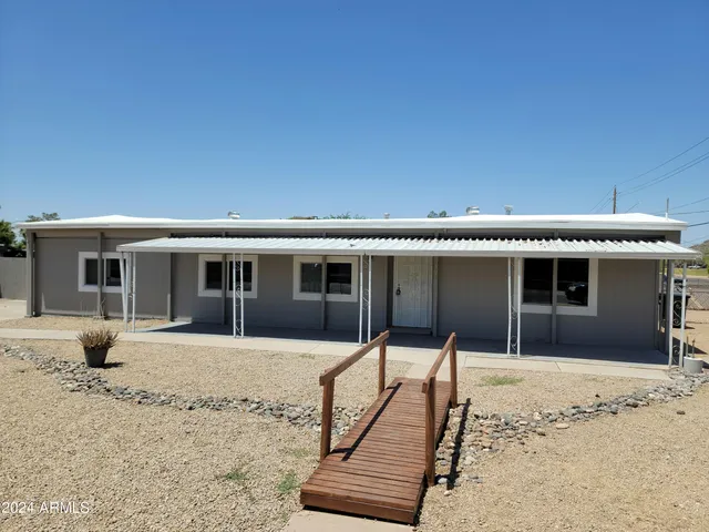 a front view of a house with yard