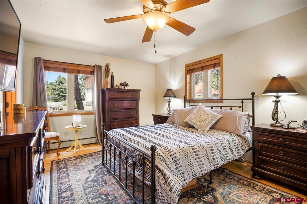 19016 Pinon Drive Cedaredge, CO 81413 - Photo 21 of 45 a bedroom with a bed and a dresser