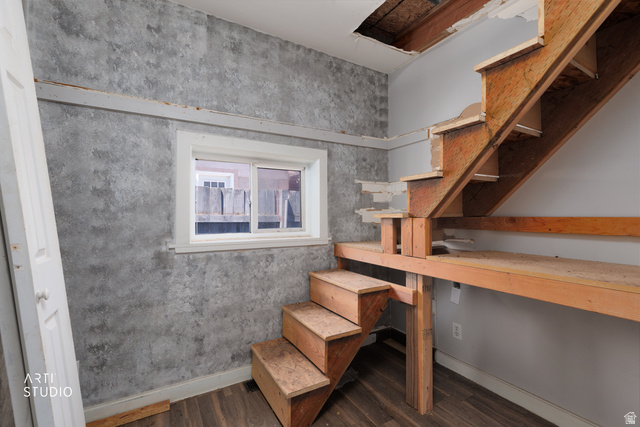 330 West 600th Street South Provo, UT 84601 - Photo 17 of 26 Open stairwell featuring unfinished wood treads and risers, wood-finish flooring, and a single window