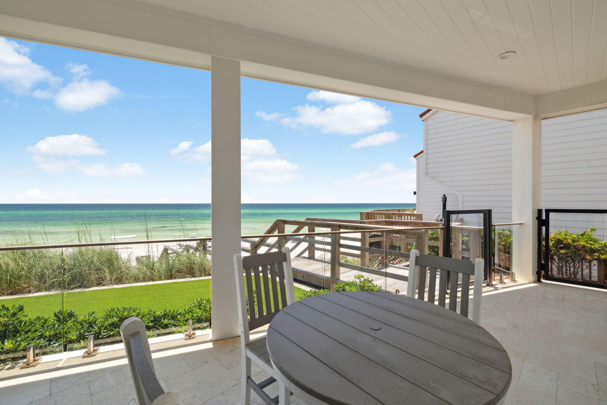 323 Pompano St Inlet Beach Inlet Beach, FL 32461 - Photo 55 of 79 a view of a balcony with floor to ceiling windows with wooden floor