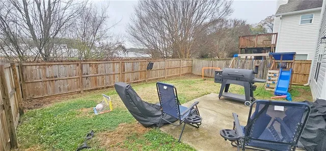 a view of a chairs and table in the patio