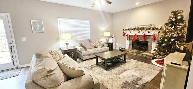 a living room with furniture and a fireplace