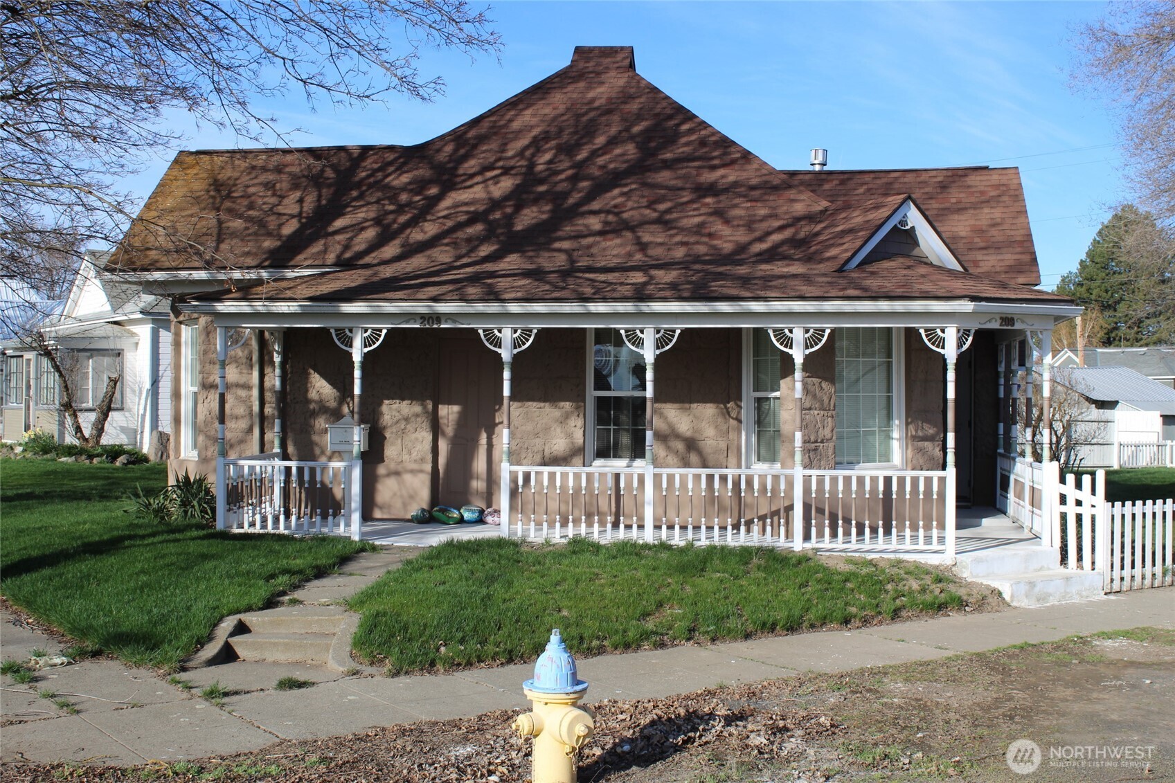a front view of a house with garden
