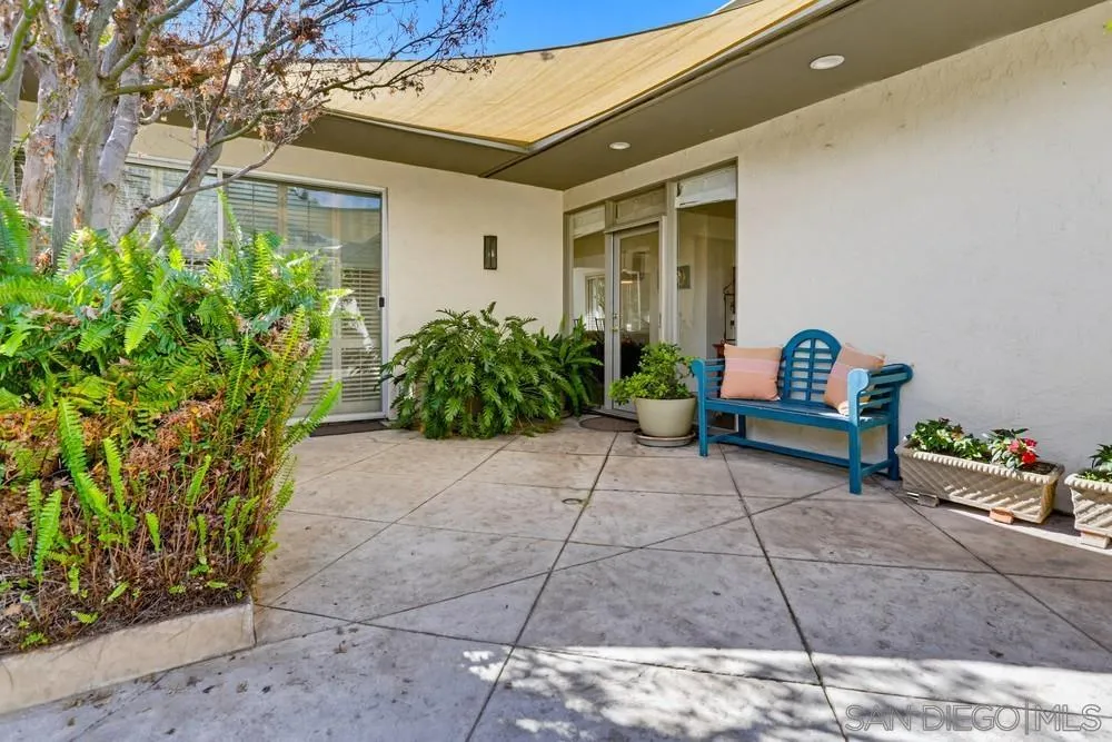 16057 El Tae Road, Unit 31 Pauma Valley, CA 92061 - Photo 4 of 25 a garden view with a chair and table in front of it
