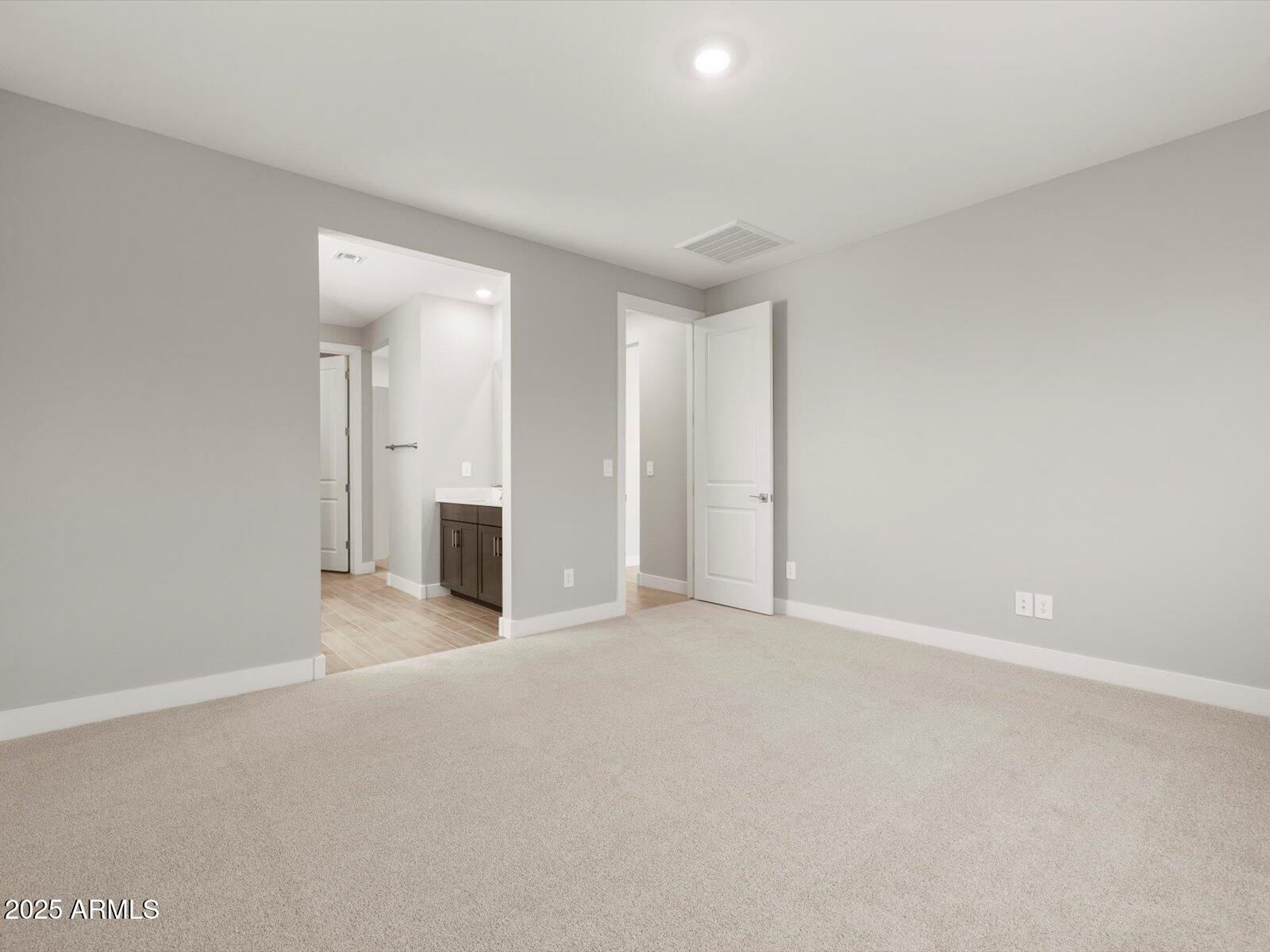 4818 North 178th Lane Goodyear, AZ 85395 - Photo 13 of 38 a view of a livingroom with an empty space and a fireplace