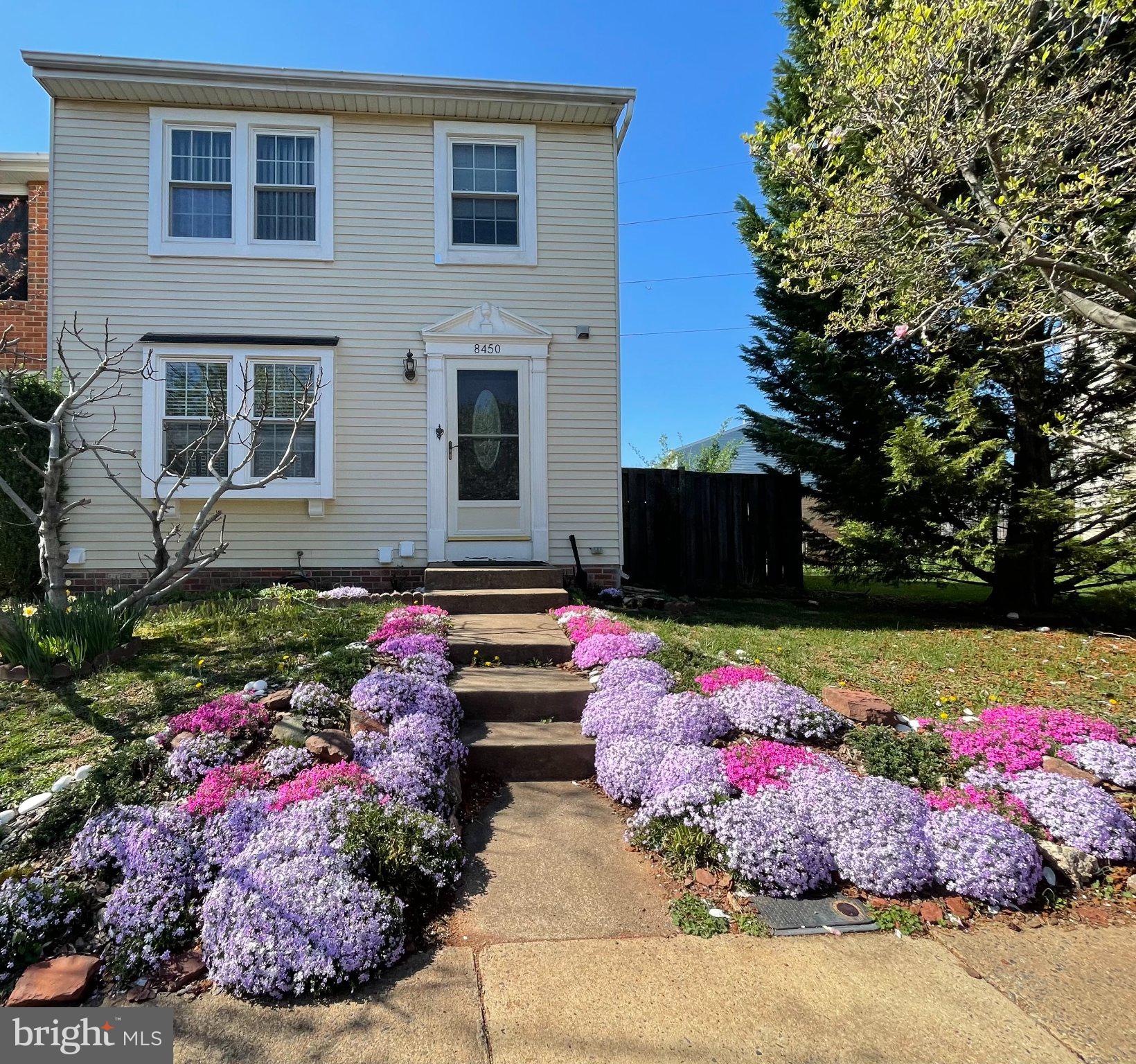 8450 Stonewall Road Manassas, VA 20110 - Photo 1 of 1 Charming home with vibrant flower beds.