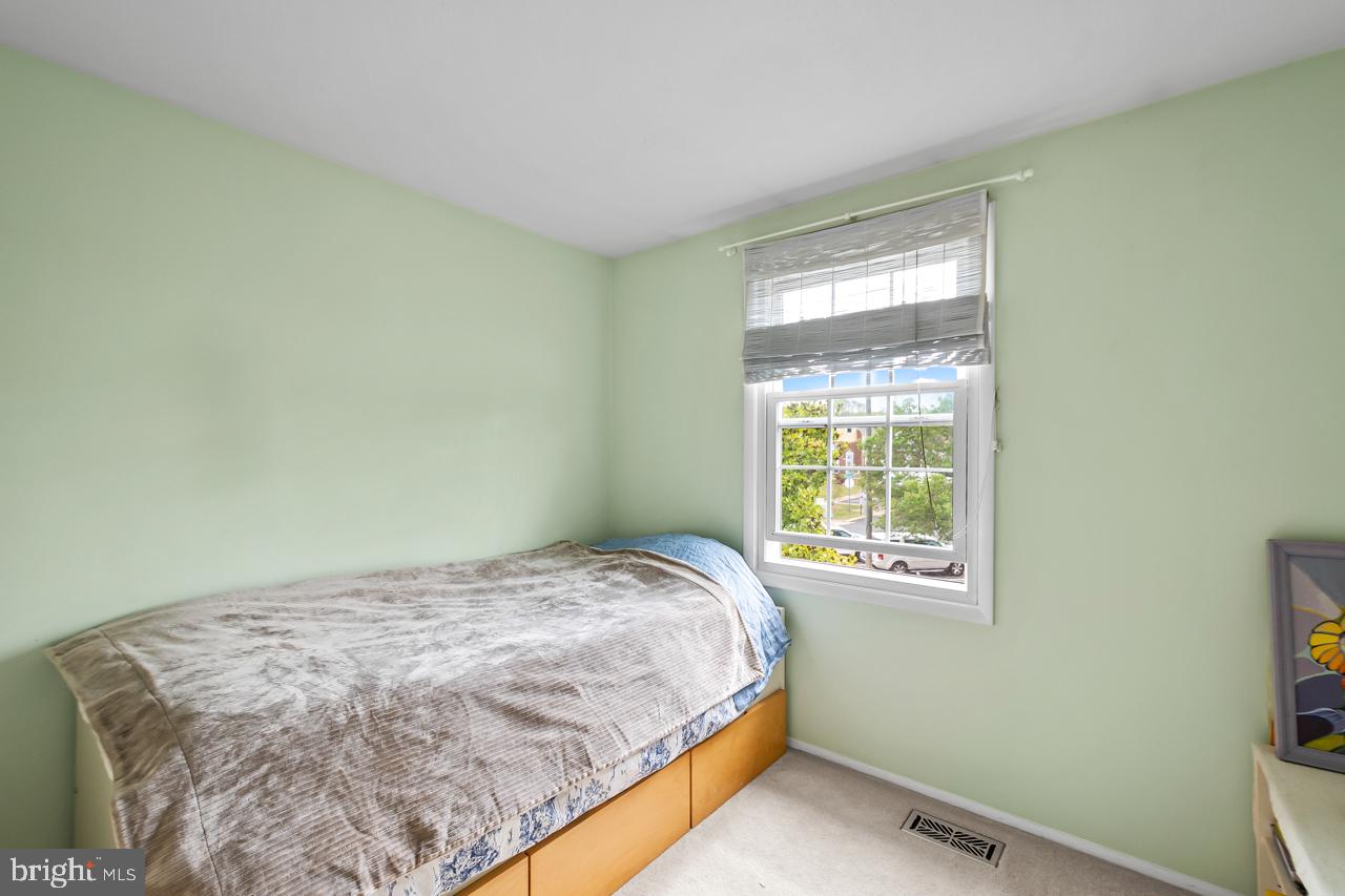 8450 Stonewall Road Manassas, VA 20110 - Photo 19 of 48 a bedroom with a bed and a window