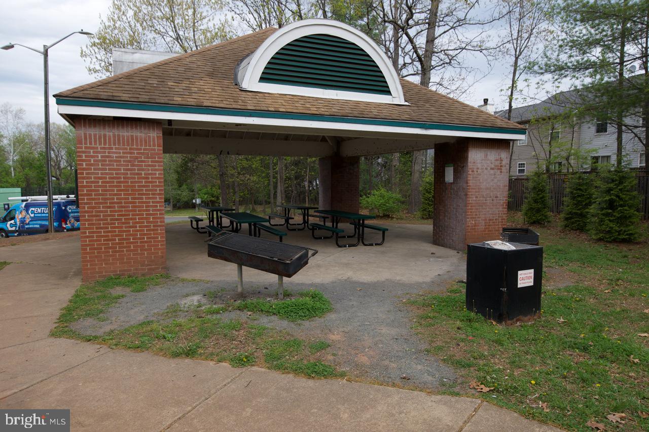 8450 Stonewall Road Manassas, VA 20110 - Photo 41 of 48 a backyard of a house with outdoor seating