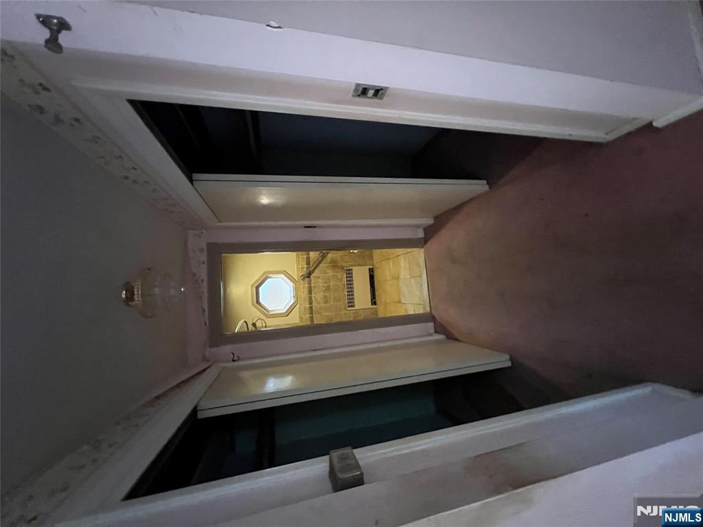 106 Prescott Street Demarest, NJ 07627 - Photo 15 of 24 a view of hallway with a front door and a mirror