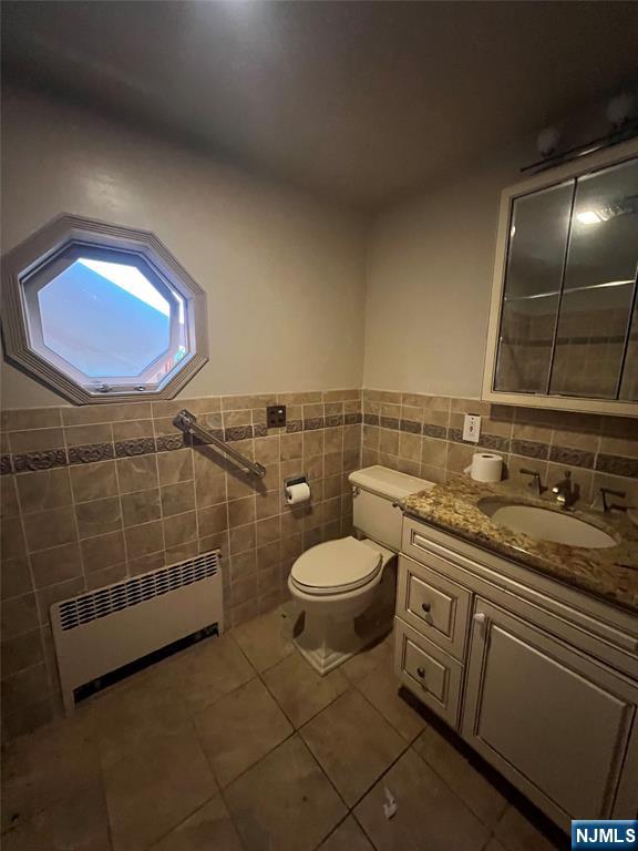 106 Prescott Street Demarest, NJ 07627 - Photo 16 of 24 a bathroom with a toilet a sink and mirror